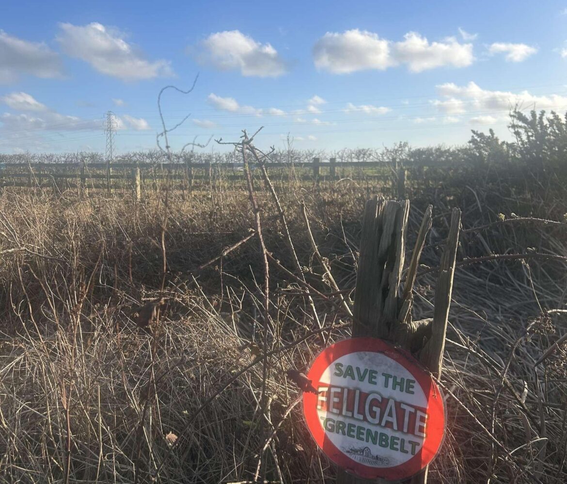 Fellgate greenbelt area with sign of the pressure group strapped onto a tree branch