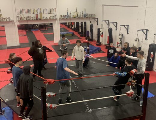 Students in the ring during a training session for full tilt academy