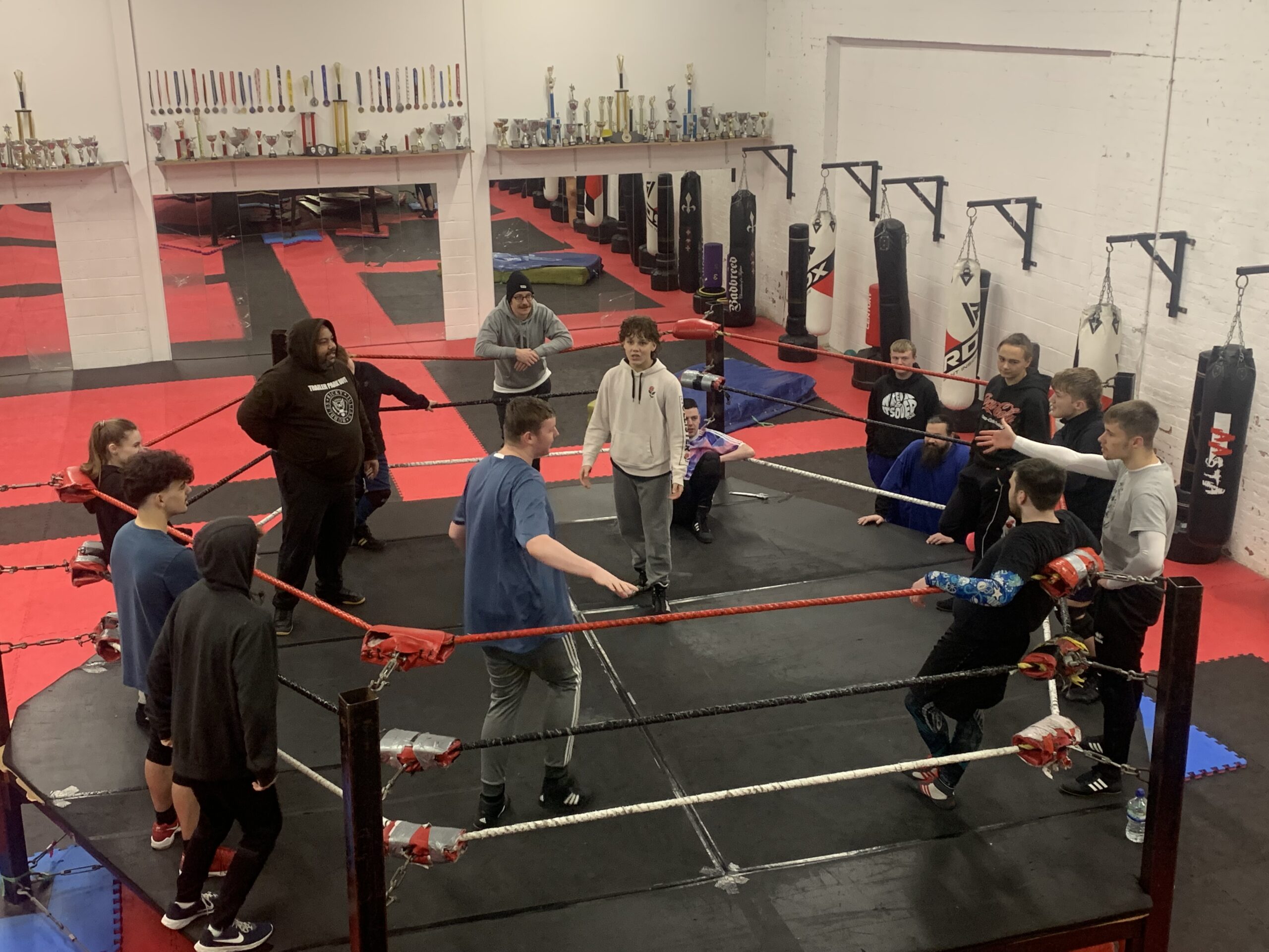Students in the ring during a training session for full tilt academy